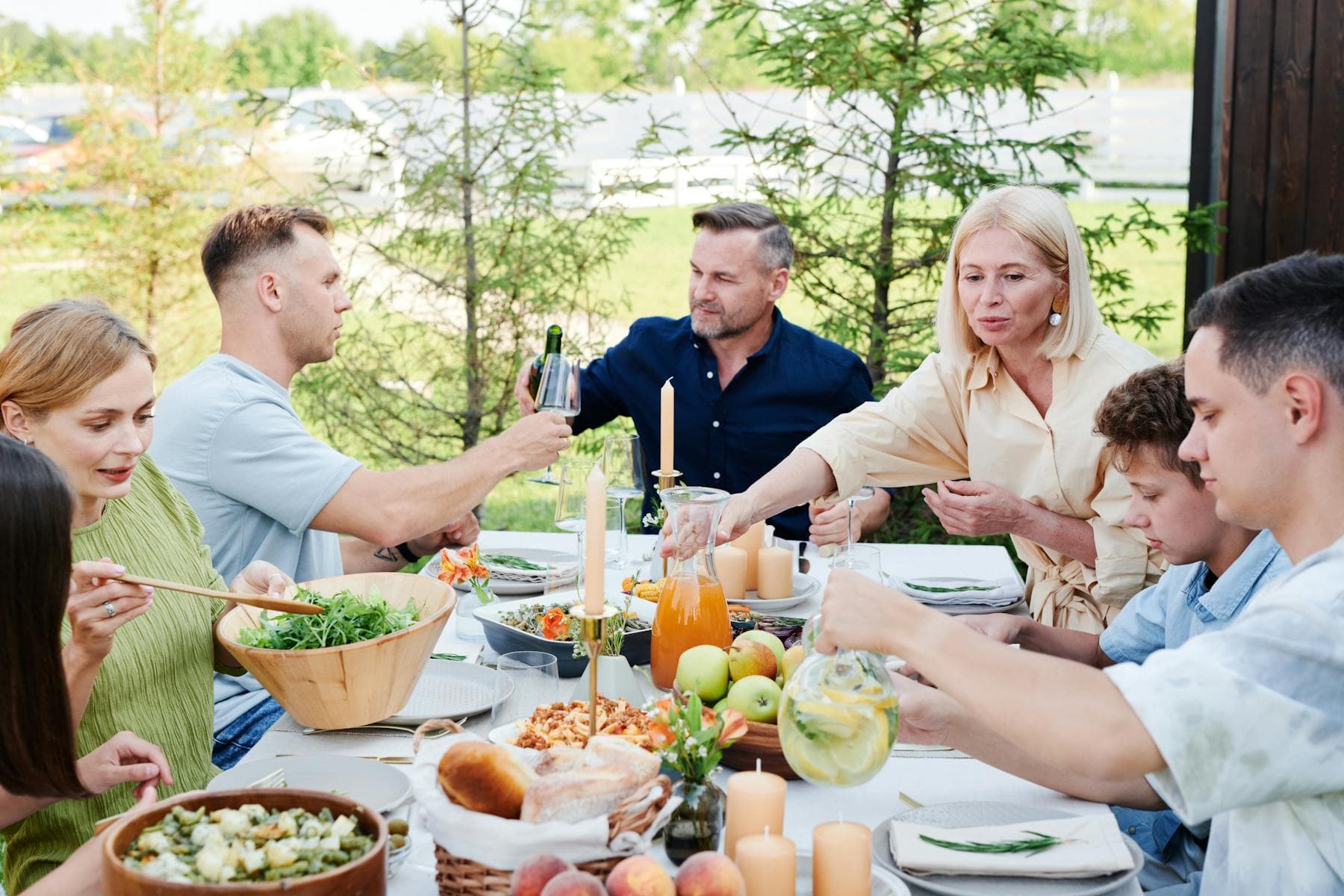 Family gathered outdoors while sharing private updates and memory context